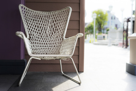 White indoor chair in shadow of sunny dayの写真素材