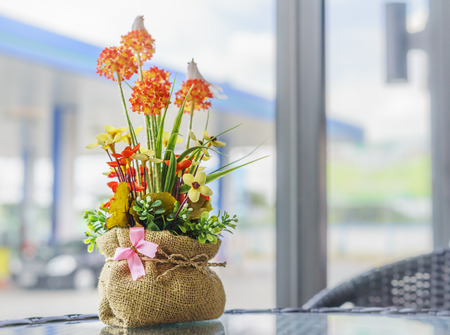 Outdoor decoration with  artificial flowers potの写真素材