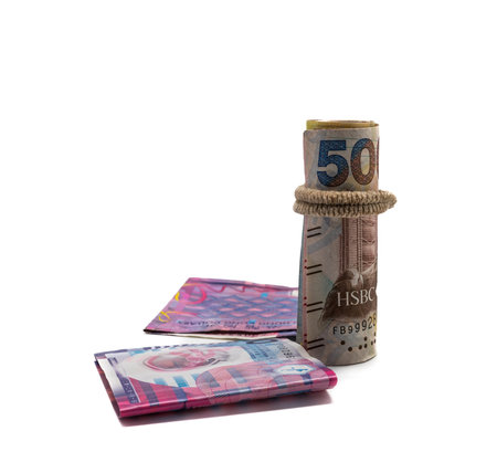 banknote folded in a roll , isolated on white background