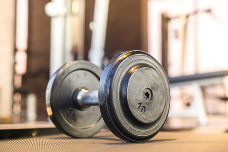 Dumbbell on the floor in fitness roomの写真素材