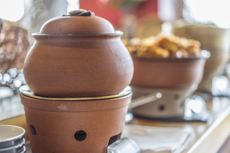 Buffet heated clay pot ready for serviceの写真素材
