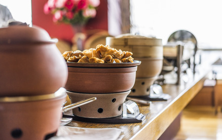 Buffet heated clay pot ready for serviceの写真素材
