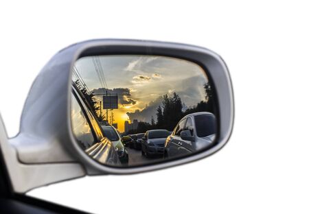 Sunset in the rearview mirror , Isolated on white backgroundの写真素材