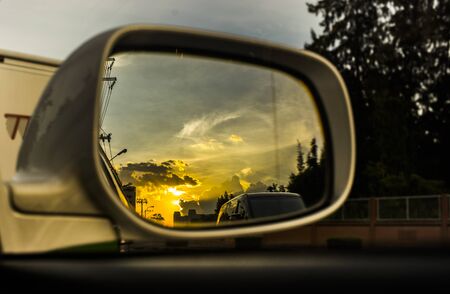 Sunset in the rearview mirrorの写真素材
