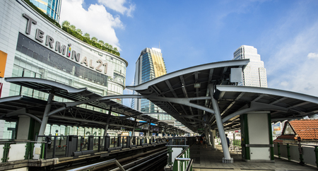 Bangkok, Thailand - October 16,2015: A BTS train rushes out of Asok station in Bangkok along Sukhumvit road.のeditorial素材