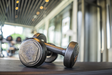 Dumbbell on the floor in fitness roomの写真素材