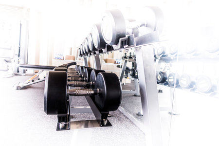 Sports dumbbells in modern sports club. Weight Training Equipment