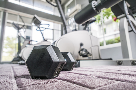 Dumbbell on the floor in fitness roomの写真素材