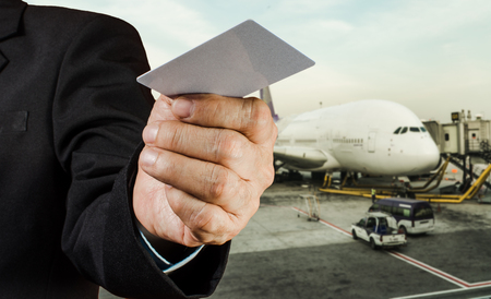 businessman showing credit card at the airportの写真素材