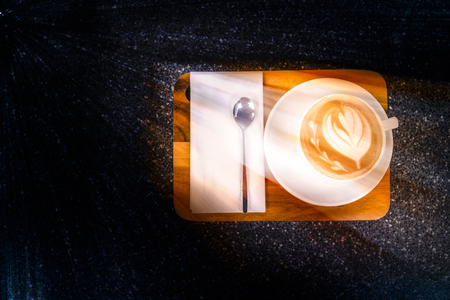 Top view of Coffee cup on the black Marble table in the morningの写真素材