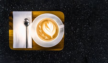 Top view of Coffee cup on the black Marble tableの写真素材