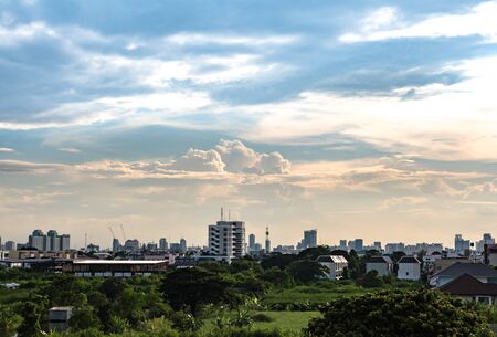 Cloudy sky over the city view from countrysideの写真素材