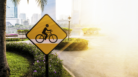 Road sign in the park :watch out for bicyclesの写真素材
