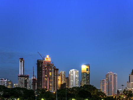 Twilight cityscape with clear blue skyの写真素材