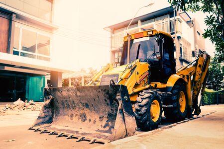 Yellow buldozer parking in the construction site at the morning : prepare for hard workingの写真素材