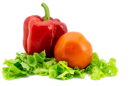 Bell pepper and tomato on top of fresh Salad , Isolated on white backgroundの写真素材