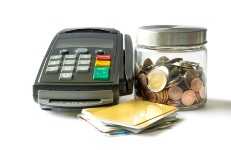 Coin in glass jar with credit card reader machine on white background : Concept for financial successの写真素材
