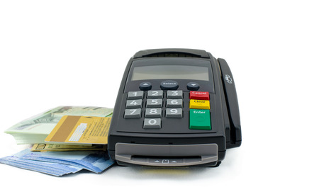 Credit card reader machine and banknote  on white background : Concept for Business and Financeの写真素材