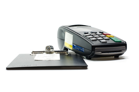 Credit card reader machine and sale slip wait for signature sign  on white background.の写真素材