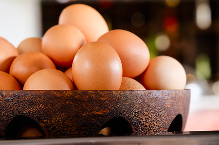 Eggs in a wood basket ,selective focusの写真素材