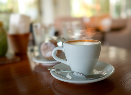 Selective focus of hot coffee on the tableの写真素材