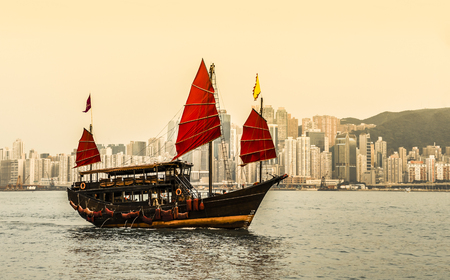 Hong Kong harbour with tourist junkの写真素材