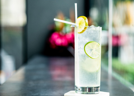 Sparkling lemon soda juice in glass served in restaurantの写真素材