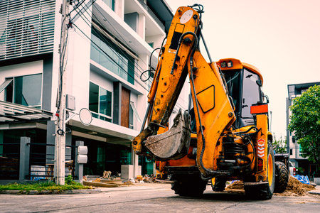 Yellow Bulldozer prepare for road repair in housing Estate