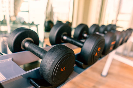 Raw of dumbbell in luxury clubhouse wait for exercise in the morning