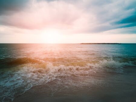 The waves washed into the beautiful and tranquil beaches in the morningの写真素材