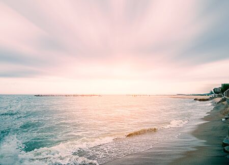 The waves washed into the beautiful and tranquil beaches in the morningの写真素材