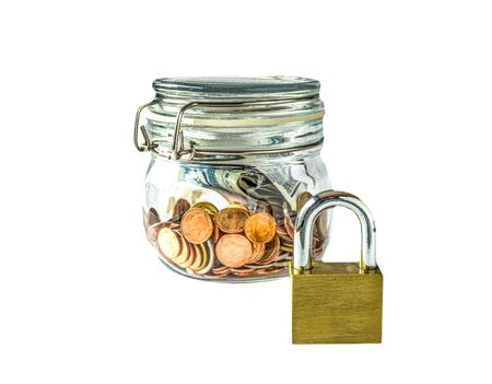 Banknote and coins in glass jar with key lock , Isolated on white backgroundの写真素材