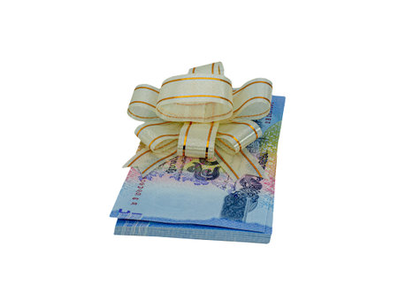 Gifts that are banknotes wrapped in a bow on white background : Concept for award and celebration