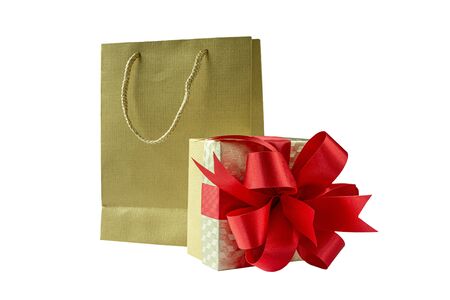 Shopping bag and gift box with red ribbon , Isolated on white backgroundの写真素材