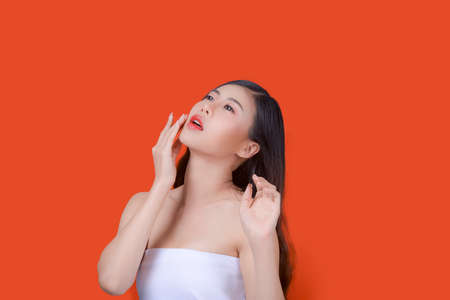 Asian beautiful woman portrait beauty hair and skin makeup young model, on Orange studioの写真素材