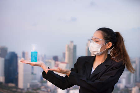 Portrait of an Asian woman wearing a black oil mask, anti-virus, or anti-Covid-19. Feeling stressedの写真素材