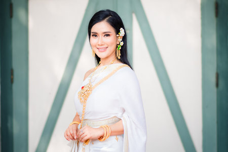 Asian Young women, Portrait of a beautiful thai woman wearing a thai dress,Smile with happiness.の写真素材