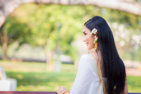 Asian Young women, Portrait of a beautiful thai woman wearing a thai dress,Smile with happiness.の写真素材
