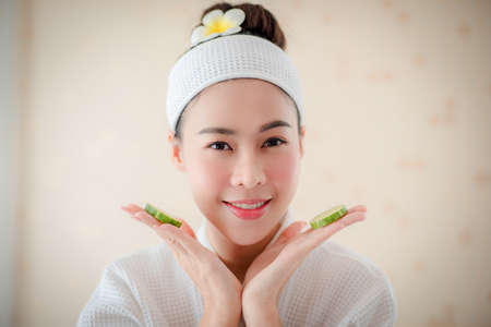 Body care. Spa body massage Asian woman hands treatment. Woman having massage in the spa salonの写真素材