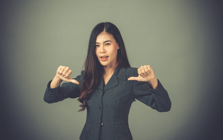 Portrait of an Asian woman, working days are very stressful.businesswoman , on Gray background in...