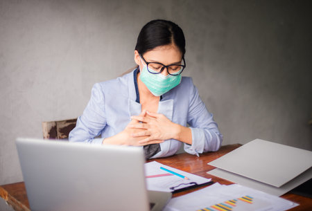 Asian business women wear masks working from home And introvert after virus outbreakの写真素材
