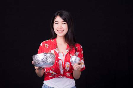 Thai girl smiling Asian beauty Swimming with ancient bowls Preserve the good culture of Thai people...