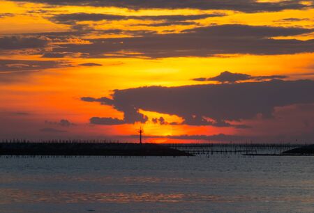 Sunset at The horizon in the eveningの写真素材