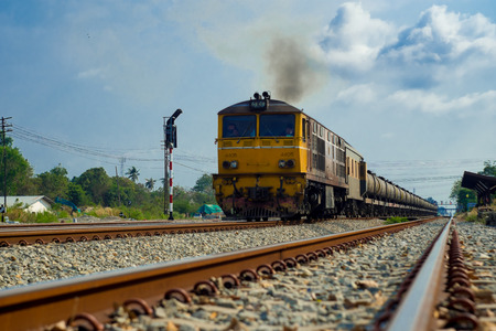 Train running on the tracks in daytime .のeditorial素材