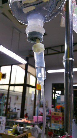 Drops of Saline  were dripping into his body.の写真素材