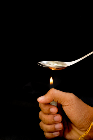 Drugs burnt in a spoon.の写真素材