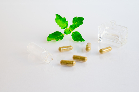 herb pills  on white backgroundの写真素材