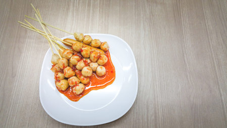 Roasted pork balls or meatballs with sweet spicy sauce