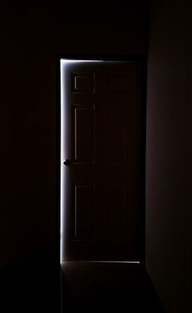 The light from the door in a dark roomの写真素材
