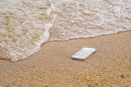 Lost Phone.Phone fell Disappear at beachの写真素材